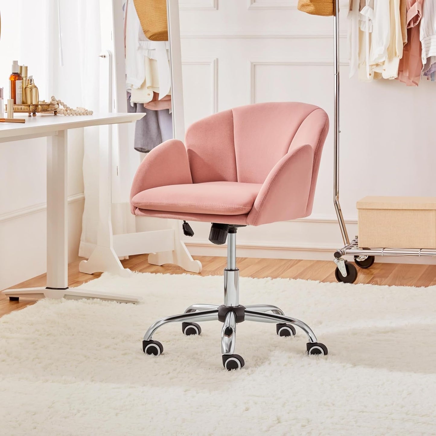 pink velvet swivel chair in bedroom vanity setup